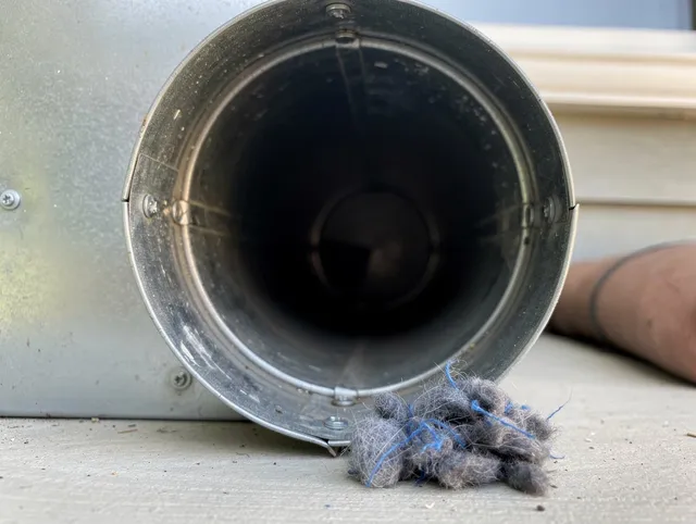 Artesia Dryer Vent Cleaning technician using specialized equipment to clear severe dryer vent blockage in Artesia